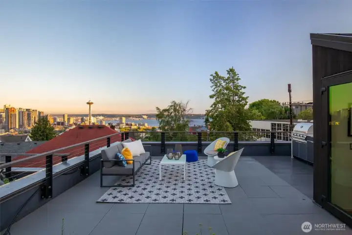 A custom NewAge® outdoor kitchen on the terrace — BBQ, refrigerator, quartz counters, custom cover. No expense spared. A custom NewAge® outdoor kitchen on the terrace — BBQ, refrigerator, quartz counters, custom cover. No expense spared.
