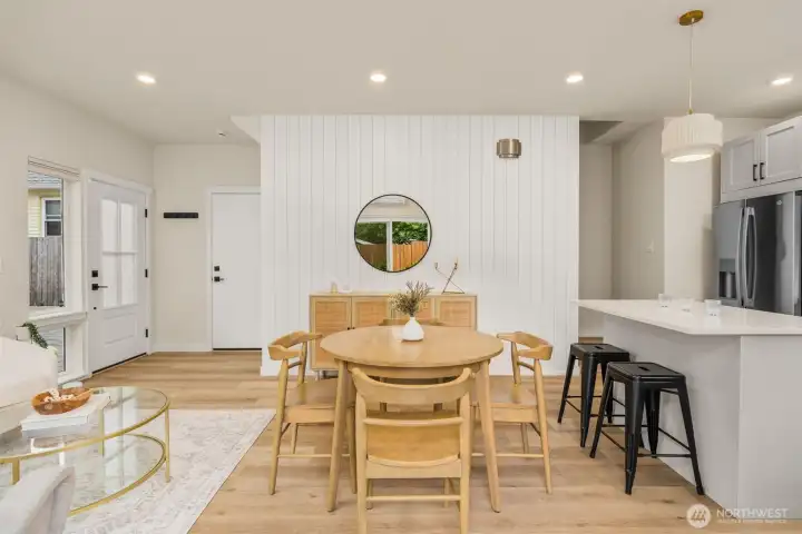 Custom feature paneled wall with electrical for a TV mount. Engineered hardwood floors. Custom feature paneled wall with electrical for a TV mount. Engineered hardwood floors.