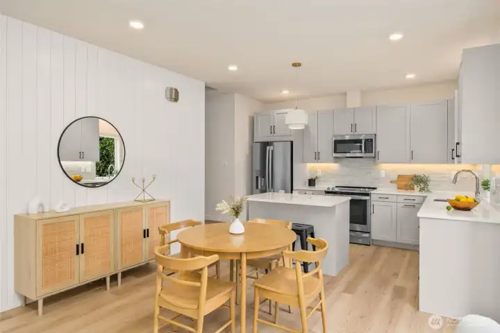 Custom feature paneled wall with electrical for a TV mount. Engineered hardwood floors. Custom feature paneled wall with electrical for a TV mount. Engineered hardwood floors.