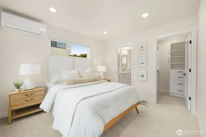 Primary Bedroom features an ensuite with a walk-in closet and a large two sink vanity bath. To the left of the room are oversized windows. Primary Bedroom features an ensuite with a walk-in closet and a large two sink vanity bath. To the left of the room are oversized windows.