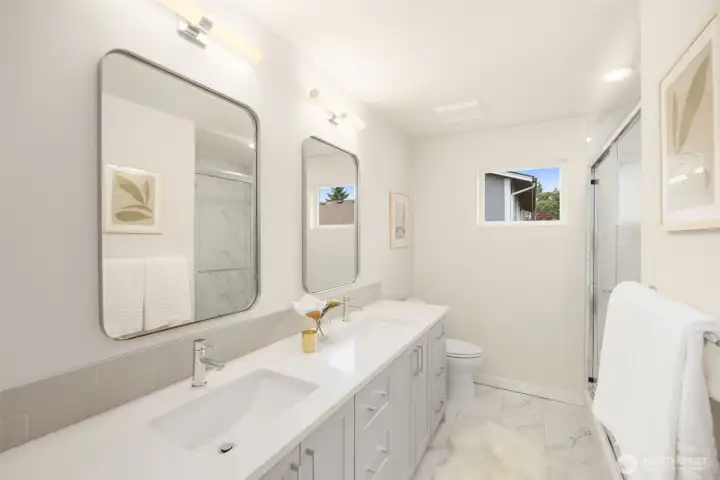 Two sink quartz vanity off of the primary bedroom. Two sink quartz vanity off of the primary bedroom.