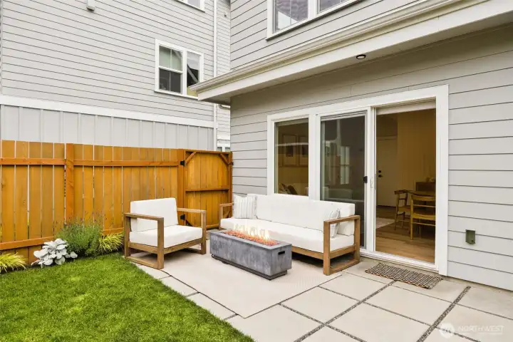 Spacious private fenced-in backyard with garden boxes and hardscaping. Spacious private fenced-in backyard with garden boxes and hardscaping.