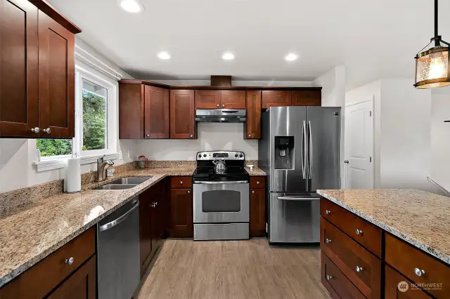 The gleaming kitchen features plenty of counter and cabinet space.
