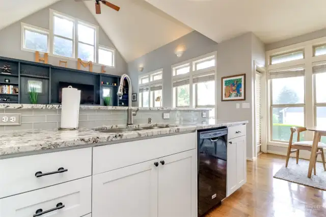 Granite countertops, white cabinets and real hardood floors