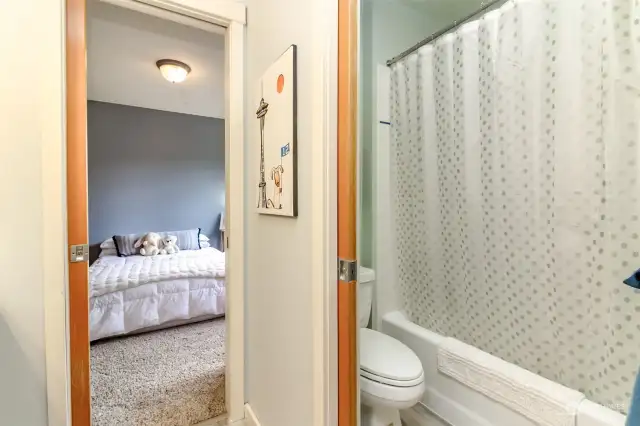 Separate toilet room and tub shower.