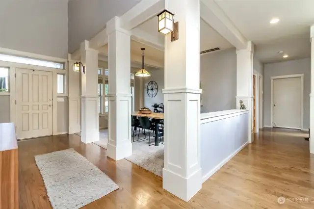 Entry, hall with hardwoods to the garage and back of the house.  Beautiful millwork and more.