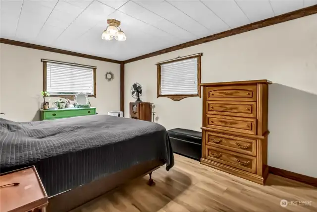 Primary bedroom, notice the hand made wood window trim.