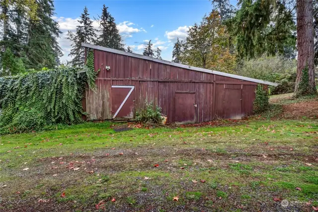 The sizeable barn is great place to store all of your toys and conveniently located close to the back side of the home.  Nestled on the back side of property.