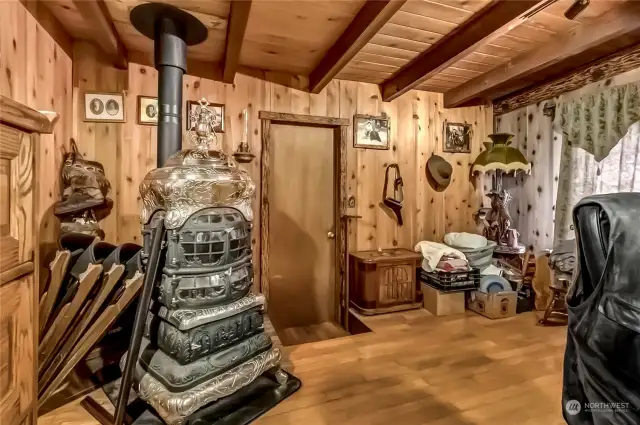 **Gas Stove Does Not Stay** This bedroom is currently being used as an office. This home has so much character  The door leads into an enclosed, heated workshop - great for your hobbies.