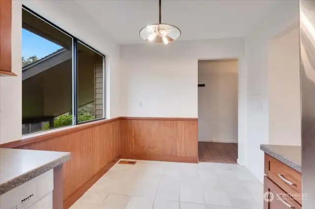 Spacious and light filled kitchen eating space .