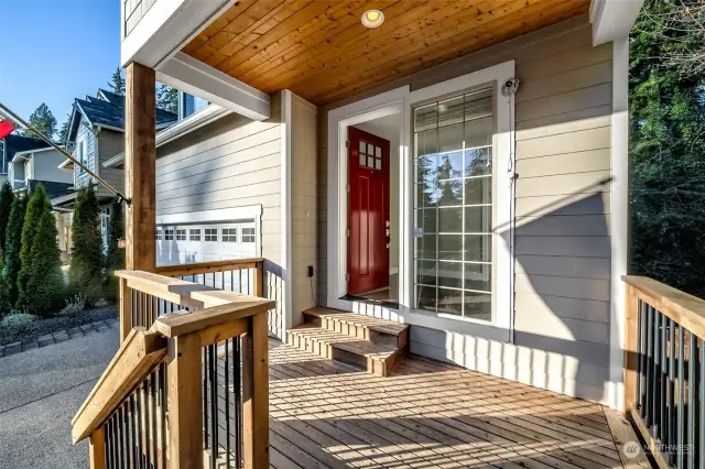 The cozy front deck creates a welcoming space to enjoy the outdoors, perfect for rocking chairs or seasonal décor.