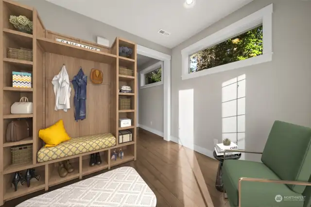 Step inside the front door to an inviting entryway full of practicality. The spacious mud area is perfect for organizing shoes, coats, and gear, keeping your home tidy and welcoming.