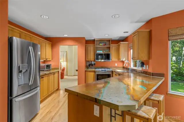Spacious kitchen with high end countertops.