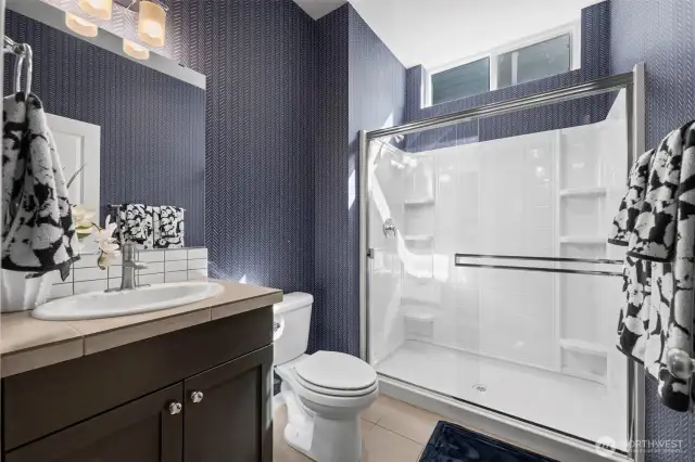 Powder room with full bath/shower can double as bathroom for main floor bedroom.