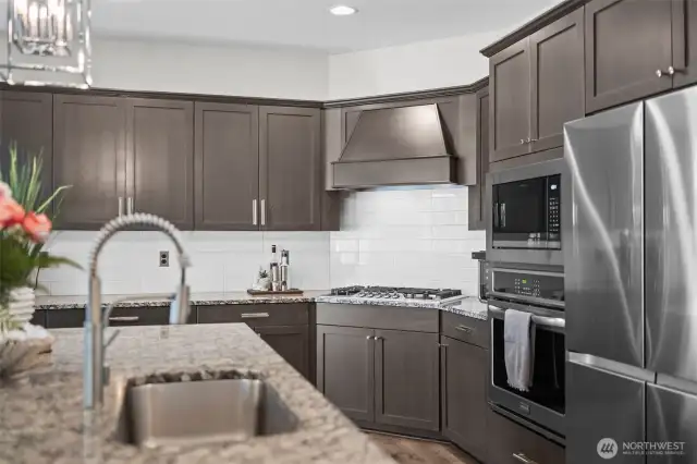 Stunning kitchen will delight the pickiest chef.  Beautiful cabinetry, a huge island and the list goes on...