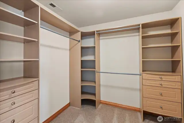 Primary closet. Organizers throughout home