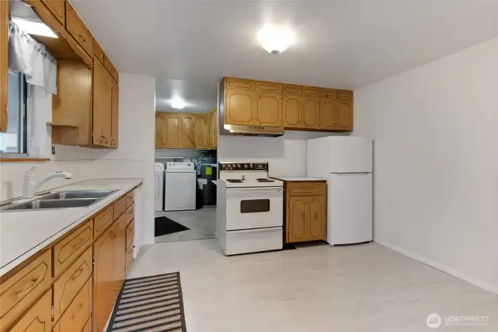 Huge kitchen, all appliances stay. Solid wood cabinets.