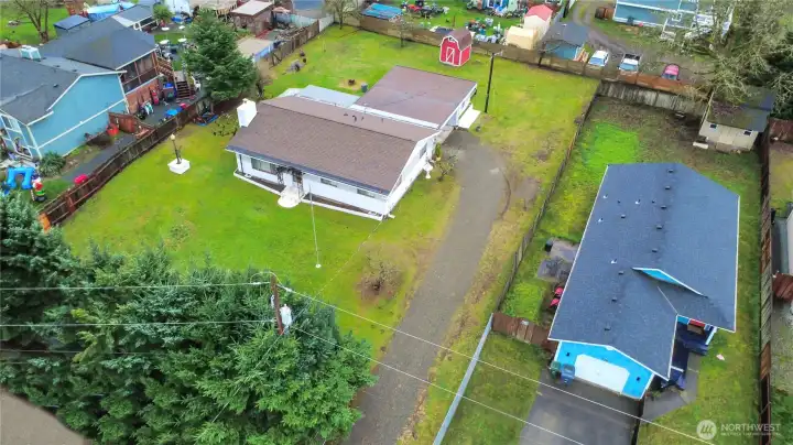 Drone shot of home on large lot. Fully Fenced.