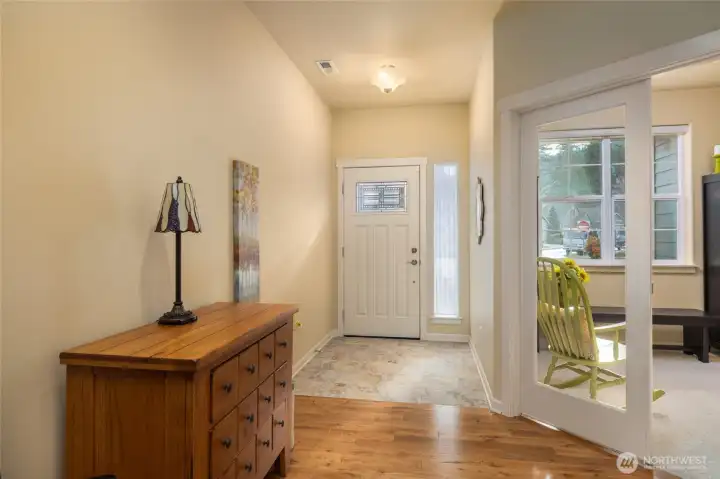 Interior front tile entry. French doors lead into office/den area