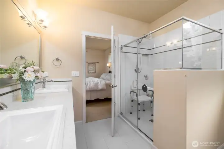 Primary bath with oversized walk-in tiled shower