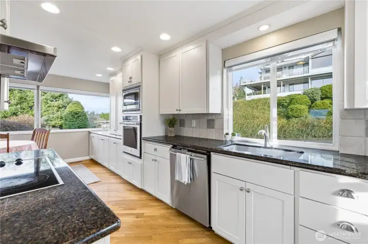 Light & bright yet private kitchen with extensive storage.