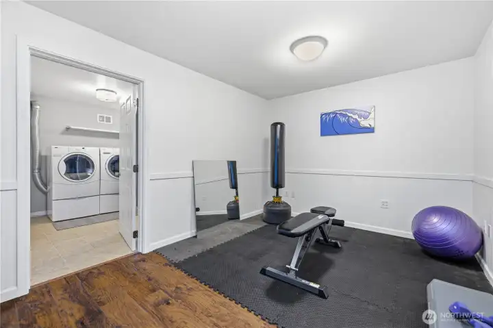 Home gym that could be converted into a secondary kitchen for multi-generational living.