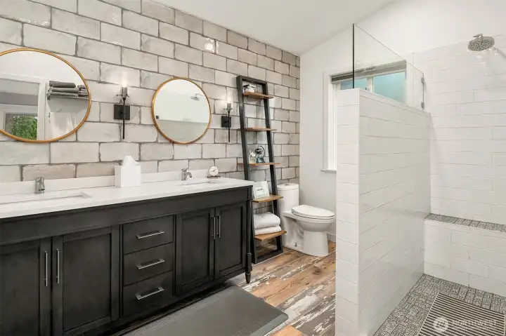 Remodeled Primary Bath featuring double vanity and large walk-in shower.