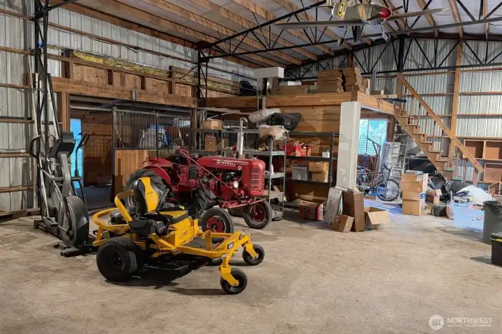 1,260 Sf Shop/Barn with 2 animal stalls and hay storage. 220Amp power. Bring your vehicles and projects!