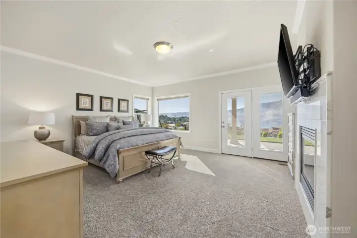 Spacious primary suite featuring elevated feel, abundant natural light, and a serene, private feel. Thoughtfully designed with generous proportions and direct access to the en suite bath, this inviting retreat offers comfort and relaxation at the end of the day.