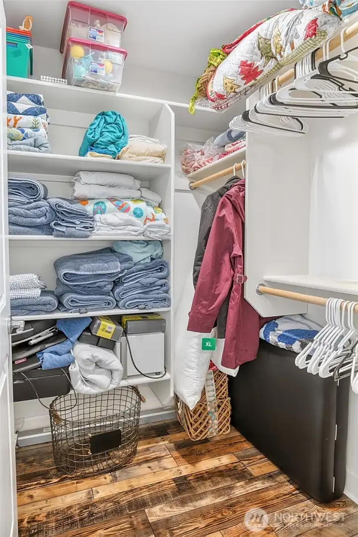 Primary Walk-In Closet with Custom Built-Ins
