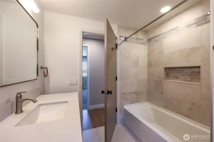 Full Bathroom in Hallway with tiled tub surround Full Bathroom in Hallway with tiled tub surround