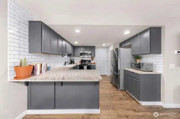 Beautiful granite countertops, newer stainless appliances, flooring and paint. Pantry in kitchen, plus garage access!