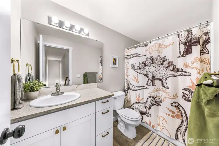 Main Bathroom, newer vanity, lights, paint, flooring and countertop!