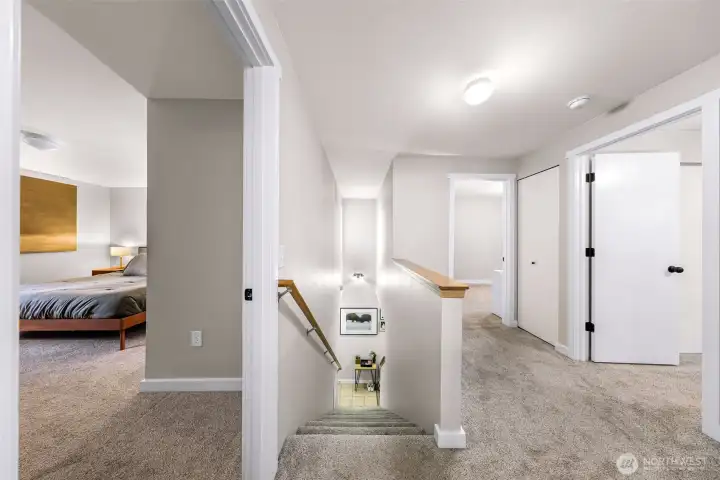 Spacious landing showing Primary Bedroom, Bedroom #2, Bedroom #3! All newer flooring, trim, and doors! Laundry area (not pictured) Newer washer and dryer!