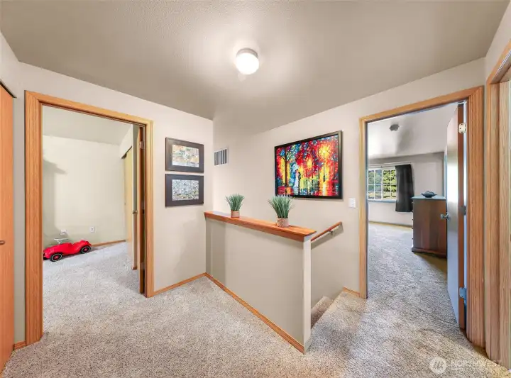 Spacious landing showing primary bedroom, bedroom #2 and bedroom #3