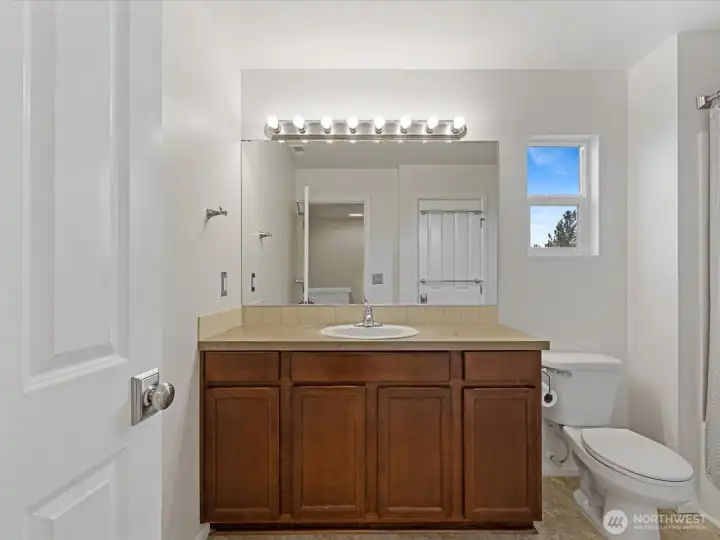 Upper level main full bathroom. Upper level main full bathroom.