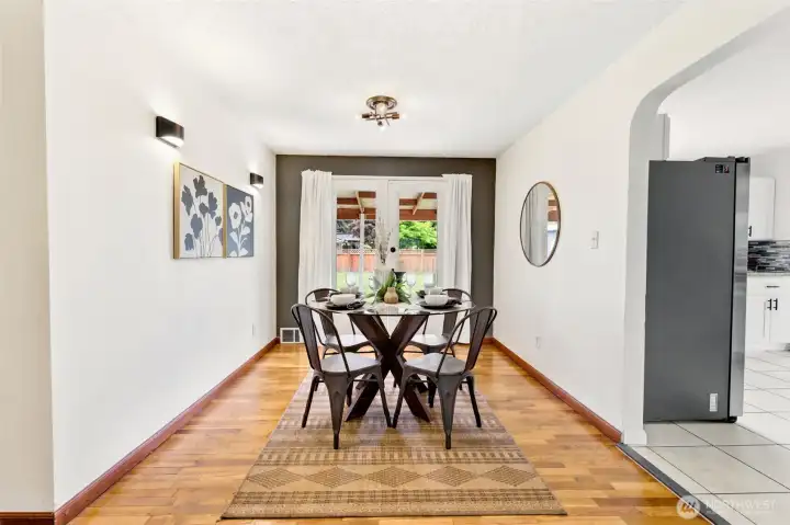 Beautiful hardwood floors flow throughout the living room, dining room, and bedrooms, adding warmth, character, and timeless appeal.