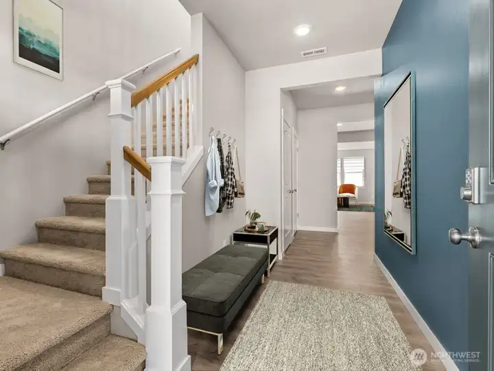 Open railing and wide hallway welcomes you upon entry. Photos are for representational purposes only. Colors and options may vary.