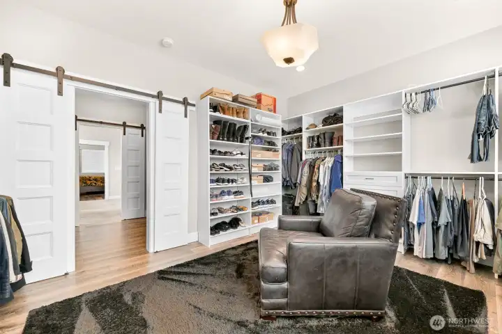 Closet with built ins and large sitting area