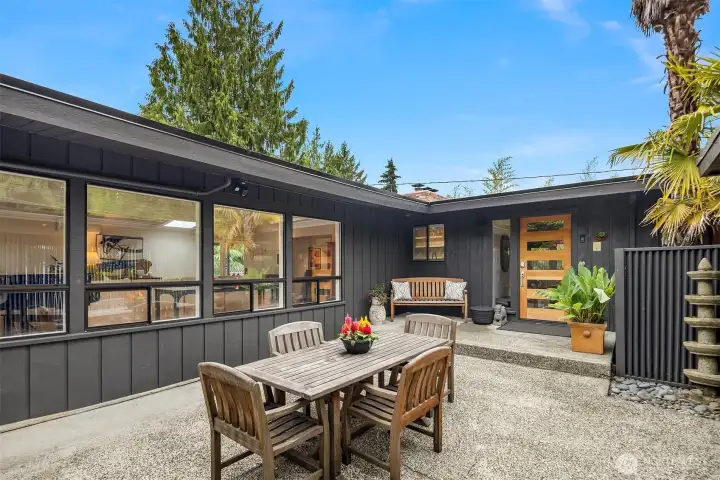 A private outdoor living area in front is tucked away out of view.