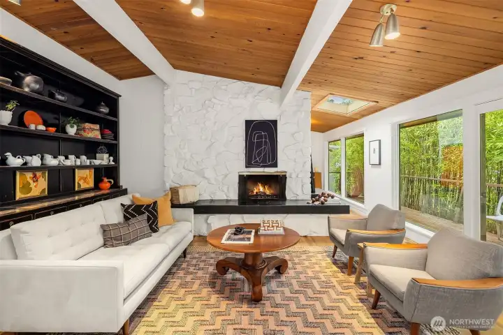 Gather around the period masonry fireplace with inviting hearth seat.
