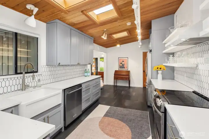 Lots of great counter space edged by a designer tile backsplash.