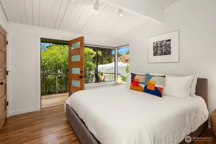 Escape to your vaulted primary suite, flowing out to the private back deck.