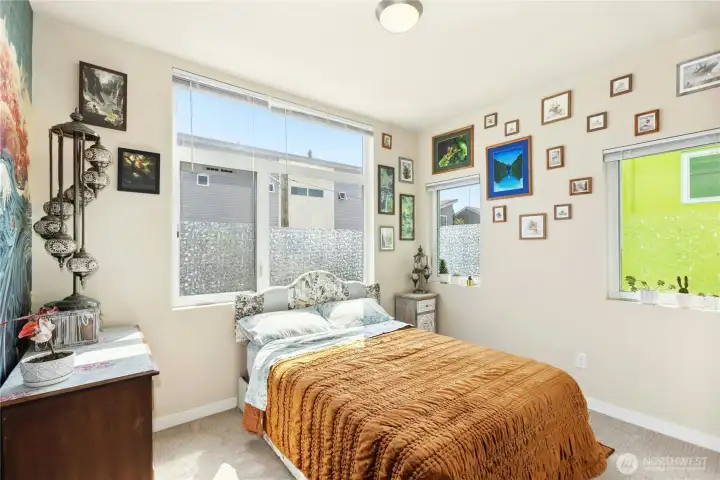 Bedroom #2 is a corner room with lots of light Bedroom #2 is a corner room with lots of light