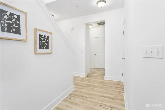Enter to a light and bright entry way with high ceilings and lots of storage