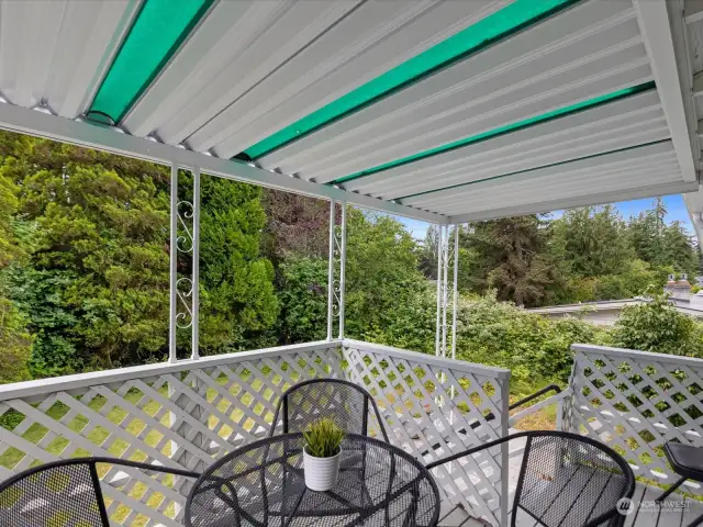 Enjoy your covered, private deck in the fenced backyard. Stairs lead to the yard.
