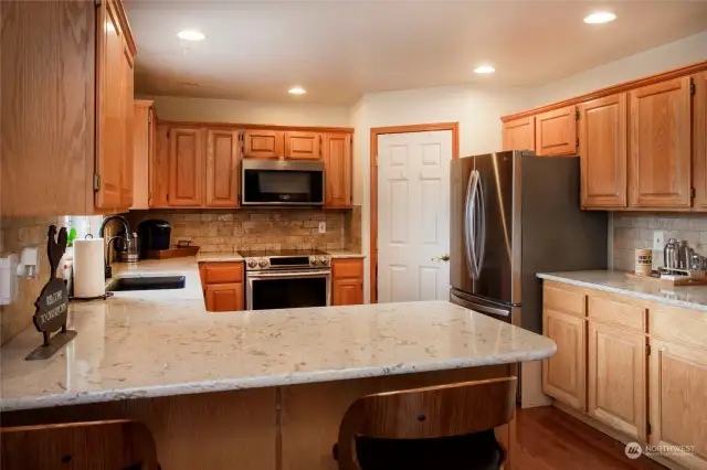 Pantry to the left of the fridge.