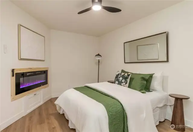 Bedroom on main - don't miss the additional storage under the fireplace