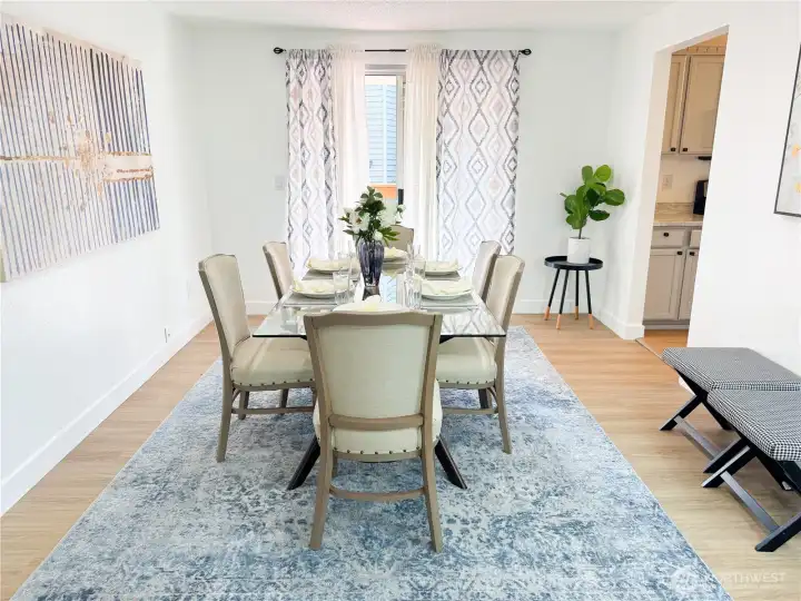 Dining room conveniently connects with kitchen on the right and an upper area deck through the sliding door.