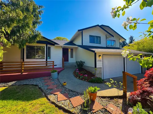 1 of top 5 photos: From front left side of the house showcasing its landscaping details.